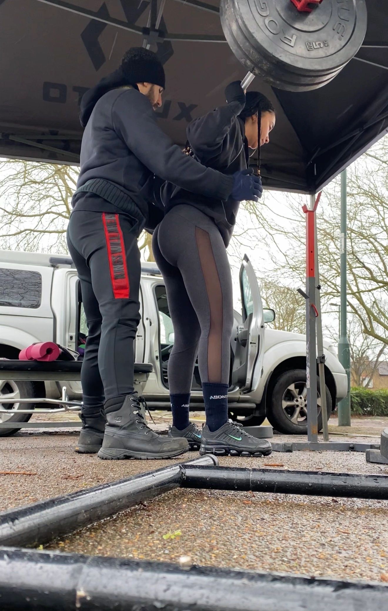 Alexandros coaching a client through a deadlift