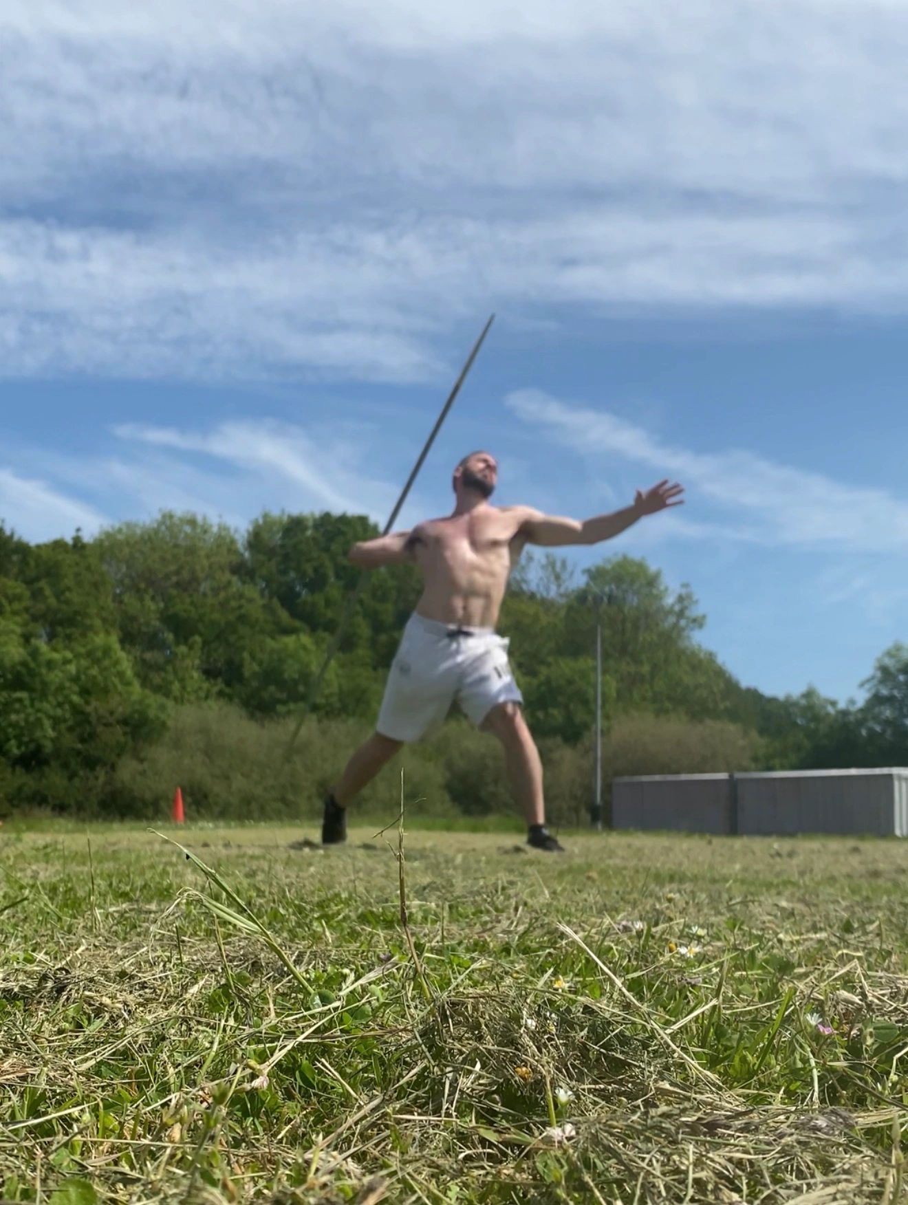 Alexandros practising the javelin throw outdoors